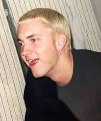 A 26-year-old Eminem photographed with the a rare Playstation 1 Debugging  Unit, 1999.