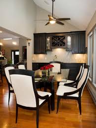 Oak and metal are durable materials that will last for years to come. Traditional Black And White Dining Room With Glass Table And Custom Wet Bar Hgtv