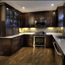 Cherry Cabinets With A Mocha Finish Kashmir White Granite And Ulvio Wood Look Tile Traditional Kitchen Design Kitchen Remodel Small Home Kitchens