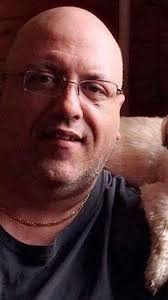 What happens to monthly pension at age 65 for injured workers?