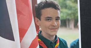 Driver using phone accelerated through red light, killing boy, 14