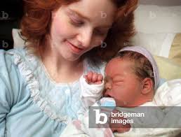 Image of WOMAN WHO HAS HAD TWO BABIES IN BACKSEAT OF HER