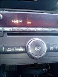 Press this button to unlock the driver's door. 2008 Saturn Outlook My Radio Is Locked How Do Unlock It Fixya