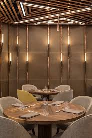 Intimate Dining Space In The Ai Restaurant Defined With Beautiful Lighting And Copper C Luxury Restaurant Interior Restaurant Design Restaurant Interior Design