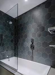 We love how the freestanding bathtub in this layout looks like the centerpiece of the bathroom, giving it a sense of modern style, while the wooden features give it that traditional touch. 75 Beautiful Modern Tub Shower Combo Pictures Ideas July 2021 Houzz