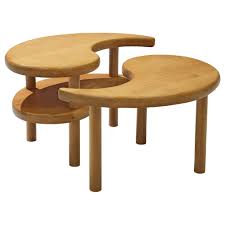 This coffee table features a built in magazine rack for storing magazines and newspapers, offers a unique lifting top, and is set on casters for easy mobility. Yin Yang Nesting Coffee Table In Beech For Sale At 1stdibs
