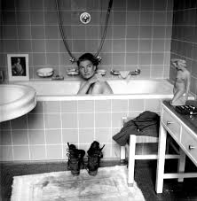American war correspondent Lee Miller takes a bath in Hitlers Munich  apartment hours after his suicide, tracking mud fresh from Dachau across  the floor. 30 April 1945 [900x918] : rHistoryPorn