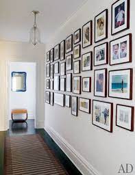 16 Photo Display Ideas For Family Pictures Architectural Digest How to make photo wall gallery.