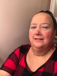 Buffalo plaid outfit change at a harp show