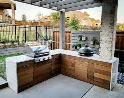 The Outdoor Kitchen Is Finally Complete Our Contractor Did A Great Job Integrating The We Outdoor Kitchen Design Outdoor Kitchen Outdoor Kitchen Design Layout