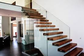 New interior wooden stairs design with glass handrails. 10 Fascinating Wood Glass Staircase Designs For Elegant Home
