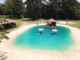 This Company Can Turn Your Backyard Into A Beach Oasis Backyard Beach Swimming Pools Backyard Backyard Pool