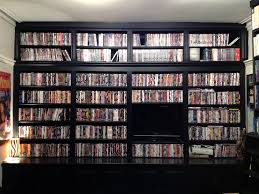Two people stumble upon the mother lode of movie memorabilia in the most unexpected of places. Our Dvd Collection We Re Running Out Of Space Home Theater Decor Dvd Shelves At Home Movie Theater