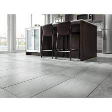Terracotta tiles are very similar in appearance to quarry tiles but tend to be quite a bit larger. Style Selections Cityside Gray Porcelain Floor And Wall Tile Common 12 In X 24 In Actual 11 81 In X 23 62 In Lowes Com Porcelain Flooring Patterned Floor Tiles Tile Floor