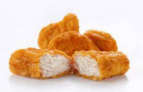 Dip chicken pieces in batter and drain off any excess. Who Invented Chicken Nuggets And What S Really In Them