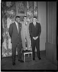 It first aired on cbs on may 8th, 1965. Short Man Standing On Chair With Arms Around Shoulders Of Two Very Tall Men Cmoa Collection