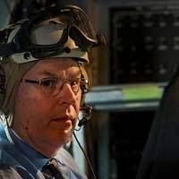 Deputy Secretary of Defense Bob Work listens to radio