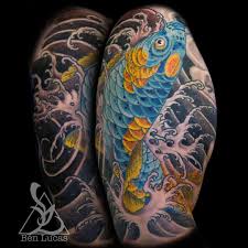 Blue And Gold Koi Fish Swimming Up And Jumping Out Of Fingerwaves Water With Pink Green And Yellow Chrysathemum Done By Tattoos For Guys Ben Lucas Cool Tattoos
