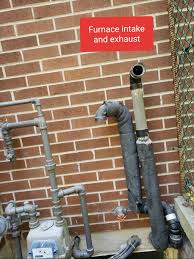 Distance between intake and straight out and intake shows 90 degree elbow facing down. Position Of Dryer Vent Relative To Gas Meter And Furnace Intake Home Improvement Stack Exchange
