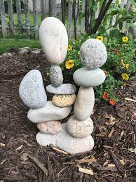 21 Exciting River Rock And Stone Garden Decorating Ideas For Your Outdoor Space Garden Stones Rock Garden Garden Sculpture