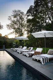 Create Your Own Poolside Resort At Home Beautiful House Pool Lounge Chairs Outdoor Pool Furniture Pool Houses