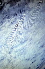 Kelvin Wakes Clouds Viewed From The Space Shuttle These Clouds Formations Are Caused When A Cloud System Runs Across Mount Clouds Clouds Pattern Scenic Photos