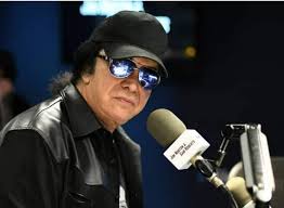 Sorry Ronnie James Dio, Gene Simmons & others......Johnny Lennon the first  to use this hand sign" circa 1968.... rock101.com