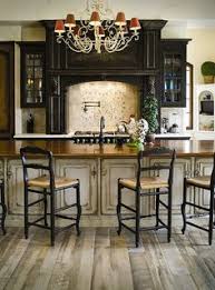 Large double ovens and range hoods, stainless steel back splash, utensil racks hung on the wall, subzero refrigeration, 2 sinks. 39 Bistro Decor Ideas Bistro Decor Bistro Kitchen Decor