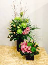 Beautiful Pink Orchids Lilies And Hydrangeas Perfectly Arranged In A Container With Ornamental Foliage And Acces Flower Delivery Office Flowers Flower Service