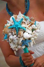 Beach wedding ideas blue shoes with wedding dress long sleeved wedding dresses carrie underwood wedding. A Little Wedding Preview Seashell Bouquet Beach Theme Wedding Shell Bouquet