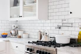 Gives tips for planning out the design, choosing tiles, installing them with adhesive or mastic and then applying grout. 13 Removable Kitchen Backsplash Ideas