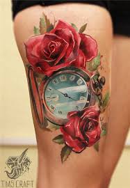 The clock is slanting to the right and is pointing at 2:30. 32 Beautiful Clock Tattoos For Girls
