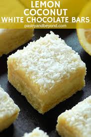 Lemon Coconut Bars With White Chocolate Ganache These Lemon Coconut Bars With White Chocolate Are Deliciou Lemon Desserts Cookie Bar Recipes Lemon Coconut Bars