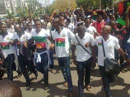 A supporter of indigenous people of biafra (ipob) leader nnamdi kanu holds a biafra flag during a rally in support of kanu, who is expected to appear at a magistrate court in abuja, nigeria december 1, 2015. Biafra News Today In Abuja