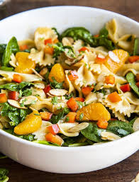 A Side Shot Of A Spinach Pasta Salad With Bow Tie Noodles Mandarin Oranges In 2020 Pasta Salad With Spinach Bow Tie Pasta Salad Recipe Recipes With Mandarin Oranges