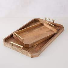 Made of mirrored glass with beveled edges, this luminous tray exudes art deco glamor and shines on side tables or atop ottomans. Buy Online Deco Handle Tray Brass Now West Elm Uae