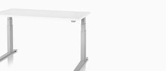 A Rectangular Sit To Stand Table With A White Top Sit To Stand Table Ergonomic Desk