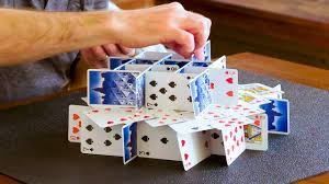 Make sure that the card is perfectly balanced between the points. How To Stack Playing Cards Wired Youtube