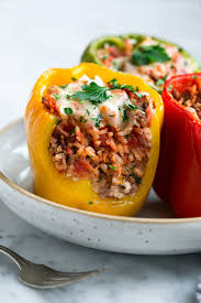 In a dutch oven over medium heat, cook the beef, olive oil, onions and garlic together while stirring beef until the meat is no longer pink and the onions are translucent, then drain. Stuffed Peppers Recipe Cooking Classy