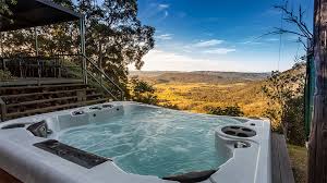 These days, the cottage has been converted into a chic, rustic, romantic getaway for two featuring an indoor/outdoor heated spa that overlooks a majestic boulder hill. Spa Accommodation Cabins Hunter Valley Nsw Australia