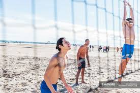 Abonner nå for å se øyeblikkelig. Men Playing Beach Volleyball On Sunny Beach Volleyball Net Outdoors Stock Photo 209604806