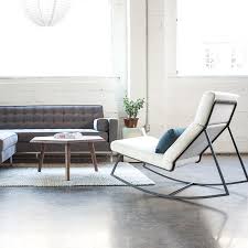 This contemporary lounge chair's frame is solid natural ash and features an interlocking truss base and finger joint detailing on the arms. Gt Rocker Lekker Home