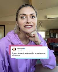 Still trying to work in a theme at my new place. 😅 Any tips?  #accessibility text: A mid-size photo of Alyson wearing a pink hoodie  looking at the camera with her chin