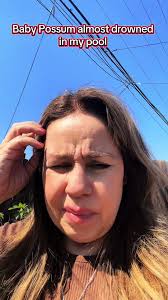 Baby Possum Video Holding A Ball in The Pool