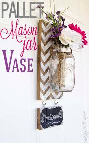 Diy wall sconce from.pallet mason jar. 38 Mason Jar Vases To Diy Today