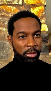 Does he look handsome in this photo?