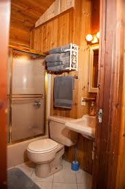 Wallpaper brings color and visual interest into a small space like a bathroom. Log Cabin Bathrooms Cabin