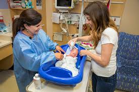 Flex (bend) leg and place bath towel lengthwise under the leg up to the buttocks. Swaddle Bath For Baby Johns Hopkins All Children S Hospital