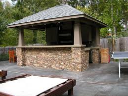 And if you have a pool, patio, or other backyard space, try to incorporate them into your layout. Outdoor Kitchens Tropical Builders