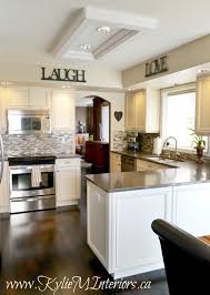 Make yours stand out with a few smart cabinetry upgrades. Cream Kitchen Cabinets With White Tiles Novocom Top
